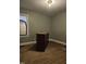 Bedroom featuring green painted walls, wood floors, and a mirror next to the window at 1210 Cypress St, Rocky Mount, NC 27801