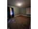 Bedroom with wood floors and window at 1210 Cypress St, Rocky Mount, NC 27801