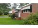 Exterior showcasing the brick facade and covered entrance of the property at 1210 Cypress St, Rocky Mount, NC 27801
