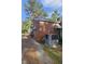 This brick home has a large AC unit and vinyl siding at 1210 Cypress St, Rocky Mount, NC 27801