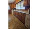 Classic kitchen with wooden cabinets and parquet flooring at 1210 Cypress St, Rocky Mount, NC 27801