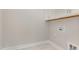 Laundry room features white cabinets, ample storage space and modern design at 1217 Linkwood Way, Fuquay Varina, NC 27526