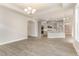 Open-concept living room showcasing hardwood floors, recessed lighting, and an archway to the kitchen at 1217 Linkwood Way, Fuquay Varina, NC 27526