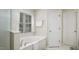 Bright bathroom featuring a soaking tub, window with blinds, and white interior door at 1505 Starmont Dr, Hillsborough, NC 27278