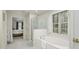 Bathroom with a soaking tub, glass enclosed shower, and a view into another room at 1505 Starmont Dr, Hillsborough, NC 27278