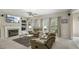 Inviting living room features a fireplace, large windows, and comfortable seating at 1505 Starmont Dr, Hillsborough, NC 27278