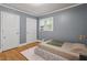 Comfortable bedroom with ample light and hardwood floors at 1615 Malta Ave, Raleigh, NC 27610