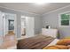 Comfortable bedroom with hardwood floors and an en-suite bathroom at 1615 Malta Ave, Raleigh, NC 27610