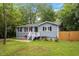 Exterior shot of home featuring fresh landscaping and manicured lawn at 1615 Malta Ave, Raleigh, NC 27610
