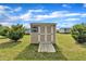 Backyard with a storage shed, white double doors, and a wooden ramp at 162 E Abbey Ct, Smithfield, NC 27577