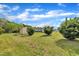 Expansive backyard with storage shed and lush green lawn with foliage at 162 E Abbey Ct, Smithfield, NC 27577