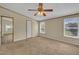 Bedroom featuring carpeted floors, a ceiling fan, and two windows at 162 E Abbey Ct, Smithfield, NC 27577