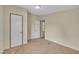 Carpeted bedroom with two closets and an open doorway at 162 E Abbey Ct, Smithfield, NC 27577