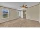 Bedroom featuring carpeted floors, two windows, and a ceiling fan at 162 E Abbey Ct, Smithfield, NC 27577
