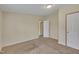 The carpeted bedroom includes a closet and an open doorway at 162 E Abbey Ct, Smithfield, NC 27577
