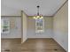 Dining area with wood floor and traditional chandelier lighting at 162 E Abbey Ct, Smithfield, NC 27577