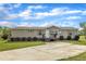 Inviting single-story home with a well-manicured lawn, complemented by a concrete driveway and covered front porch at 162 E Abbey Ct, Smithfield, NC 27577