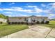 Charming single-story house featuring a cozy front porch, complemented by a well-maintained lawn and concrete driveway at 162 E Abbey Ct, Smithfield, NC 27577