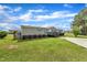 Quaint single-story house enhanced by a spacious green lawn, accompanied by a concrete driveway and a pleasant porch at 162 E Abbey Ct, Smithfield, NC 27577