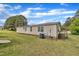Exterior of home with an air conditioning unit, deck, and green lawn at 162 E Abbey Ct, Smithfield, NC 27577