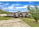 Attractive single-story home showcasing a neatly landscaped front yard, paired with a concrete driveway and a welcoming porch at 162 E Abbey Ct, Smithfield, NC 27577