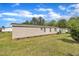 Home exterior with siding, air conditioning, and lush green lawn at 162 E Abbey Ct, Smithfield, NC 27577