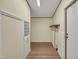 Hallway featuring wood-look floors and a utility closet at 162 E Abbey Ct, Smithfield, NC 27577
