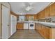 Kitchen features wood cabinets and white appliances at 162 E Abbey Ct, Smithfield, NC 27577