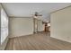 Open living room featuring wood-look floors and a ceiling fan at 162 E Abbey Ct, Smithfield, NC 27577