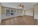 Spacious living room featuring laminate flooring, fresh neutral paint, and multiple windows for natural light at 162 E Abbey Ct, Smithfield, NC 27577