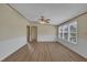 Inviting living room featuring new laminate flooring, fresh neutral paint, and a bank of windows for natural light at 162 E Abbey Ct, Smithfield, NC 27577