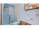 Neutral-toned bathroom featuring white fixtures and a walk-in shower at 1635 Sandy Cross Rd, Burlington, NC 27217