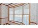 Close up of the dining room bay window featuring white blinds and window seat at 1635 Sandy Cross Rd, Burlington, NC 27217