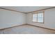Well-lit bedroom with soft carpet, a large window, and neutral paint at 1635 Sandy Cross Rd, Burlington, NC 27217