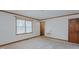 Bright bedroom featuring a large window, soft carpet, and neutral paint at 1635 Sandy Cross Rd, Burlington, NC 27217