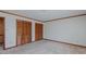 Spacious bedroom features two closets and unique patterned wallpaper at 1635 Sandy Cross Rd, Burlington, NC 27217