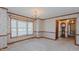 Light-filled dining area with floral wallpaper, chandelier, and bay window at 1635 Sandy Cross Rd, Burlington, NC 27217