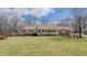 Lovely red brick ranch home featuring a charming front porch and a well-manicured lawn at 1635 Sandy Cross Rd, Burlington, NC 27217