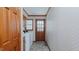 Laundry room with washer and dryer hookups, cabinets and backyard access door at 1635 Sandy Cross Rd, Burlington, NC 27217
