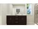 Modern bathroom vanity with dual sinks, sleek fixtures, and a large mirror at 189 Tennyson Dr # 236, Garner, NC 27529