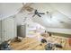 Spacious attic with hardwood floors, exposed beams, and ample room for customization and storage at 1900 High Oaks Ln, Raleigh, NC 27606