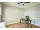 Bright bedroom with hardwood floors, neutral walls, and a modern desk area for a functional workspace at 1900 High Oaks Ln, Raleigh, NC 27606