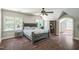 Bedroom featuring hardwood floors, a ceiling fan and lots of natural light at 1900 High Oaks Ln, Raleigh, NC 27606