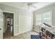 Bedroom setup as a music room, featuring hardwood floors, closet, and an abundance of natural light at 1900 High Oaks Ln, Raleigh, NC 27606
