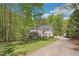 Attractive two-story brick home with a covered front porch and long driveway at 1900 High Oaks Ln, Raleigh, NC 27606
