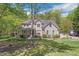 Attractive two-story brick home with a covered front porch and well-maintained landscaping at 1900 High Oaks Ln, Raleigh, NC 27606