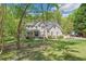 Attractive two-story brick home with a covered front porch and well-maintained landscaping at 1900 High Oaks Ln, Raleigh, NC 27606