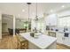 Bright open kitchen with a center island, stainless appliances and dining area at 1900 High Oaks Ln, Raleigh, NC 27606