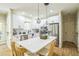 Well-equipped kitchen with stainless appliances, white cabinets, and a spacious island at 1900 High Oaks Ln, Raleigh, NC 27606