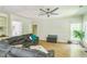 Inviting living room features hardwood floors, built-in shelving and a modern ceiling fan at 1900 High Oaks Ln, Raleigh, NC 27606